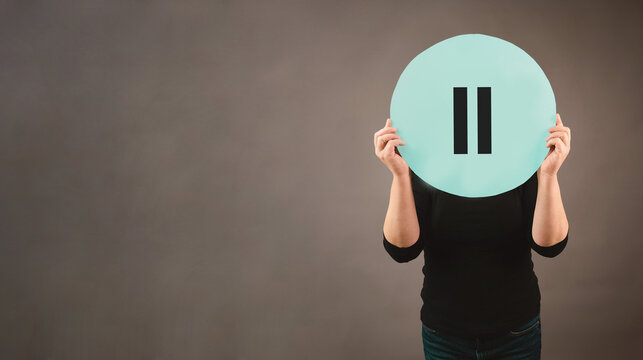 Woman holding pause sign, take a break, mental exhaustion by stress, menopause concept, hormone replacement therapy, self care lifestyle