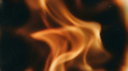 Vibrant orange flames dancing against a dark background evoking warmth and energy