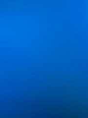Fototapeta premium The photograph, taken with a camera, has a background color tone of blue and navy. The image contains white with shades of light blue, navy, dark blue, and black, creating a gradient of colors and lig