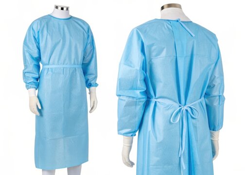 Blue disposable medical gown with long sleeves, ties. Protective clothing for health care professionals. Healthcare worker wears protective garment