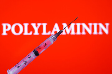 The word Polylaminin appears on the screen with a medical syringe