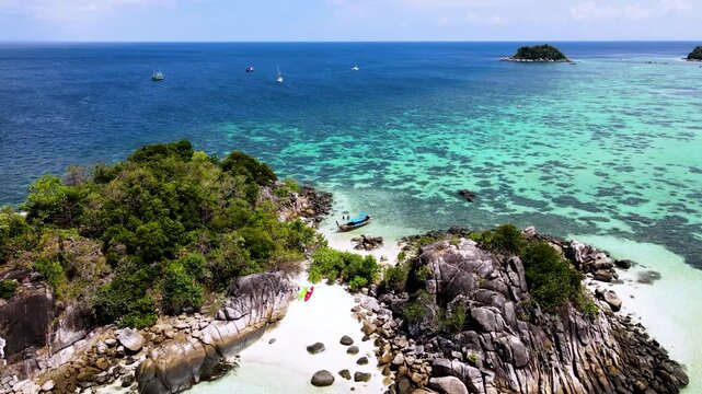 Discover the breathtaking beauty of Koh Lipe, Thailand, where crystal-clear waters meet sandy beaches.