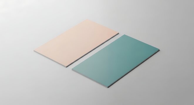 Two blank rectangular cards, one beige and one teal, placed side by side on a light grey background.