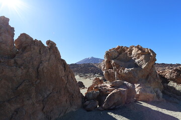 Panoramic view of volcanic rocks and vast arid landscape in Teide National Park Tenerife under clear blue sky. Dramatic nature scenery expressing freedom, solitude and awe. Captured by Canon R6 Mark I