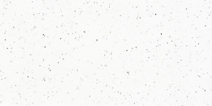 Monochrome white paper texture with small black and grey speckles. Recycled textured concept and subtle craft grain background