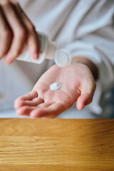 Dispensing skincare lotion onto hand for daily routine