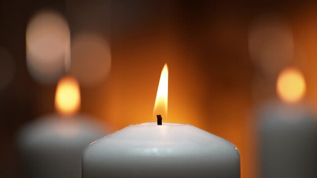 Flames Of White Ceremonial Candles Dancing In A Tranquil Spa Atmosphere in Slow Motion