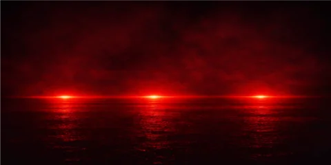 Papier peint photo Marron An abstract red sunset sky with dramatic orange rays and clouds reflecting over a dark blue sea landscape at dusk with central space for text  © alien