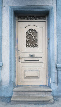 Antique door; Old wooden closed door; Old door on the porch