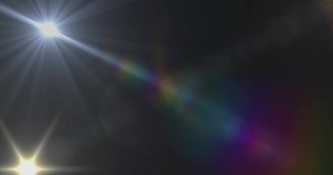 Animation of lights with multicolour halo moving over black background