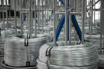 Close-up of Galvanized Iron Wire Raw Material Coils in the Machinery & Iron Factory Workshop