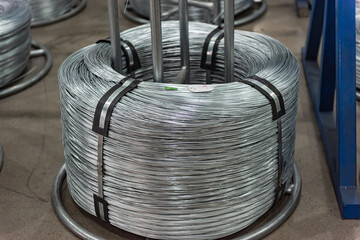 Close-up of Galvanized Iron Wire Raw Material Coils in the Machinery & Iron Factory Workshop