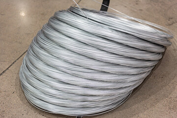 Close-up of Galvanized Iron Wire Raw Material Coils in the Machinery & Iron Factory Workshop