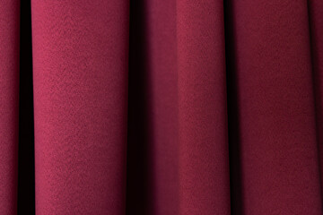 Fototapeta premium Macro Texture of Burgundy Fabric Curtains with Soft Vertical Folds