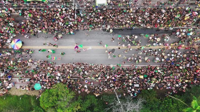 Brazilian carnival. Aerial top down view of the street block carnival named Samambloco on the street of the town of Campeche, Florianopolis, Brazil