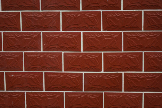 Red Textured Brick Wall with White Grout