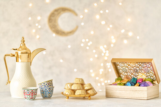  Semolina maamoul cookies , colorful chocolate candies with dallah and ramadan decor . Traditional arabic Eid al Adha, Eid al Fitr , Ramadan sweets	