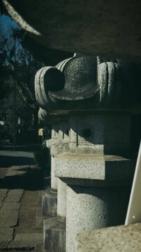Row of Traditional Japanese Stone Lanterns at a Shrine, Zen Atmosphere Vertical