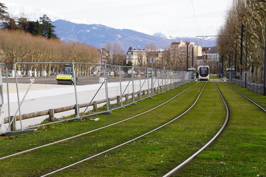 Grenoble France February 18 2026 Urban redevelopment works at Esplanade district with excavators infrastructure installation Tram E line future city park transformation and Foire des Rameaux event 