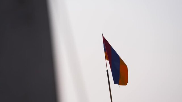 Armenia flag, Armenian flag waving on sky at dusk. Armenia national flag displaying freedom and pride.  red, blue, orange bands symbolizing liberty, peace, courage, heritage, unity, resilience, tradit