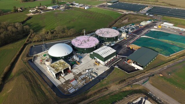 Aerial view of the Horse Close Green Power plant, with its cylindrical storage tanks and surrounding green fields, Horse Close Green, Northampton, United Kingdom.