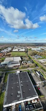 Aerial view of nLighten Data centre contrasting the dark rooftops against the bright sky, Milton Keynes, United Kingdom.