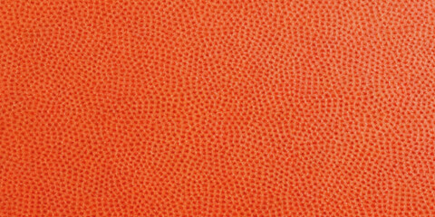 Obraz premium Close up view of a vibrant orange textured fabric showcasing a small dot pattern high quality