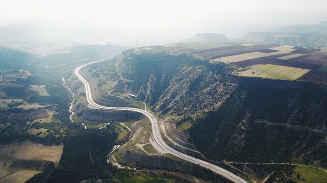 Aerial view of a winding road near Kula Fairy Chimneys Natural Monument in Turkey