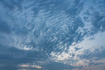 Obraz premium Saint-Aubin-Sur-Mer, France - 08 11 2025: Sky Background. Detail view of the sunset over the beach with clouds and the sun