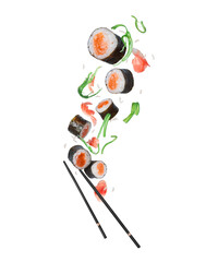 Floating sushi rolls with salmon and green algae in the air on a white background