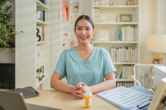 Female healthcare professional reviewing medical documents at desk with laptop in clinic office, administrative medical workflow, patient record management and modern healthcare documentation concept.