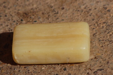 A single bar of pale yellow soap