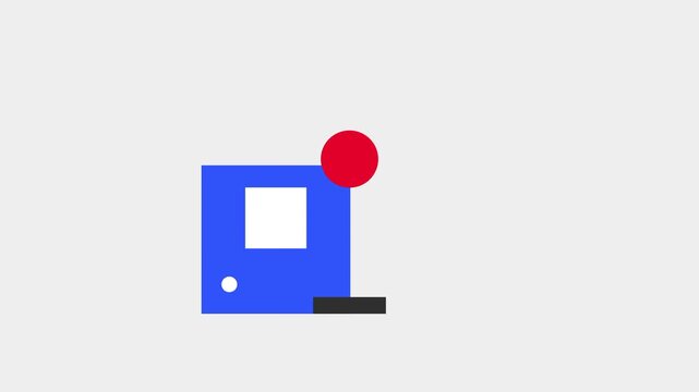 A blue desktop computer sits next to a red joystick on a gray surface to represent a classic workstation setup for old school video game playing
