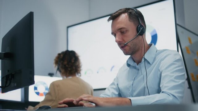 Professional Businessman, Customer Support Agent Working in a Modern Office, Providing Customer Support, Consulting Clients, Contacting Customers, Help, and Managing Sales Conversation with CRM System