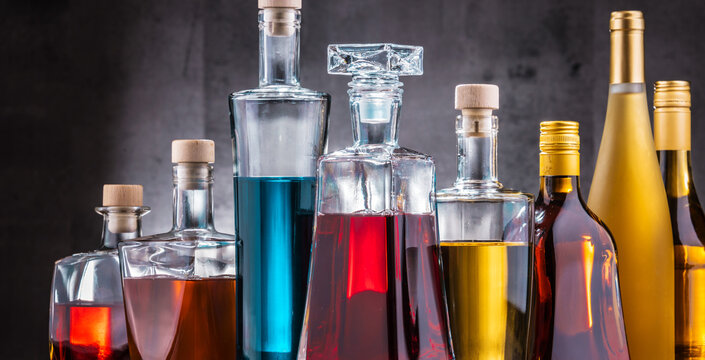 Carafe and bottles of assorted alcoholic beverages.