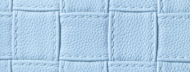 Fototapeta premium Texture light blue leather background with quilted stitched pattern, macro. Abstract pastel upholstery surface