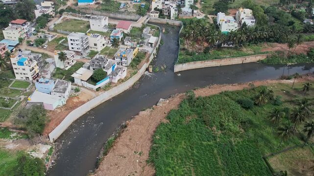 A drone view shows Bengaluru&rsquo;s large drainage canal overflowing with filthy industrial sewage water