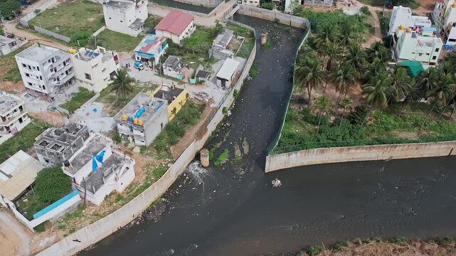 A drone view shows Bengaluru&rsquo;s large drainage canal overflowing with filthy industrial sewage water
