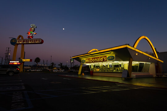 Neon lights illuminate the oldest operating McDonald&rsquo;s restaurant. Downey, California &ndash; September 2020