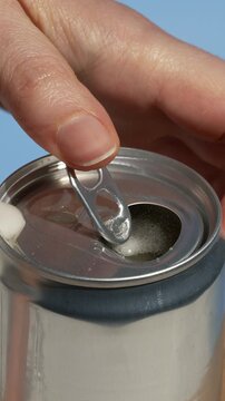 Opening a tin can with healthy, flavored fresh sparkling kombucha. Iced fizzy drinks, and summer vibes.