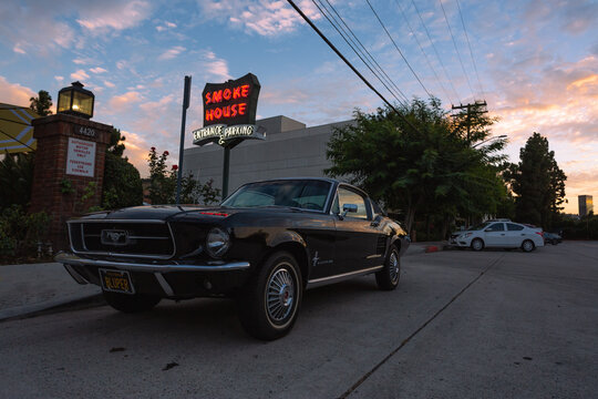 A vintage Ford Mustang parked at The Smoke House, a famous Burbank restaurant built in 1946, in Burbank, California. August 2020