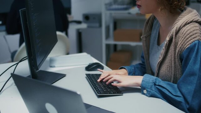 Portrait of Female Programmer Hands Typing Code on Desktop Computer, Screen Displaying Programming Information. Female Software Engineer Focused on Developing Applications Writing code at office.