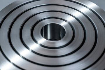 Concentric metal rings, industrial precision, machined steel texture, technological background, concentric pattern
