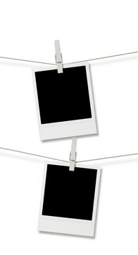 Two rows empty instant photo frames hanging on a string with clothespins on a white background, perfect template for adding images or text. Generative AI.
