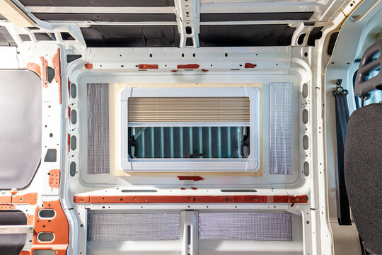 Camper van conversion. new window. Camper van conversion. installing a side window. Inside of a camper van. 