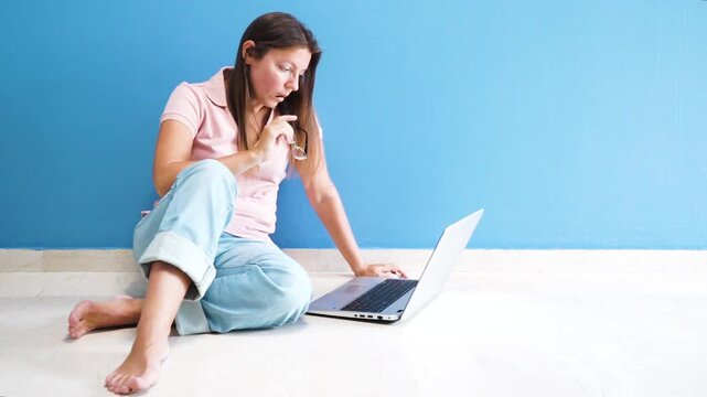 person working with a laptop, woman typing on notebook