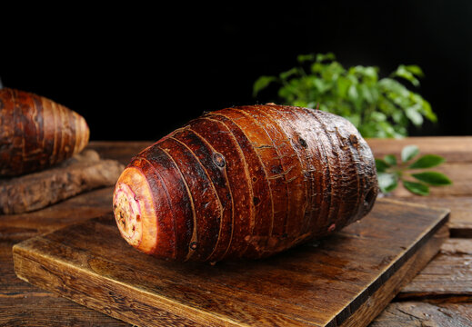 Fresh Taro Root Sliced on Wooden Board - Guangxi Province Asian Vegetable