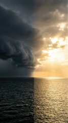 Obraz premium Dark storm clouds and bright sunlight over ocean. Split image of light and darkness. Creation of light and dark on the first day.