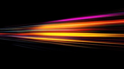 Abstract colorful light trails against a black background