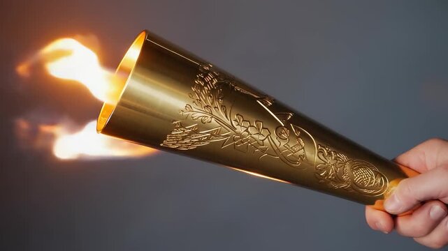 Hand Holding Flaming Torch - Symbolic Representation of Hope, Progress, and Celebration with Warm Light